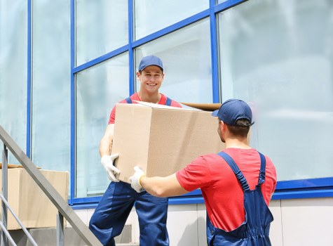 Moving van and packed boxes for a home move in Brent