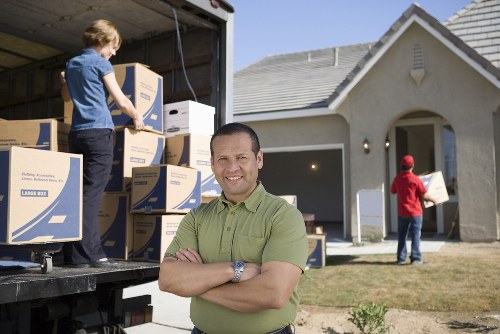 Man With A Van Brent team loading items safely with protective equipment