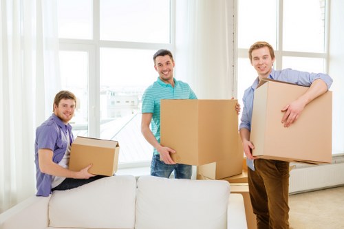 Small removals team handling household items in Brent